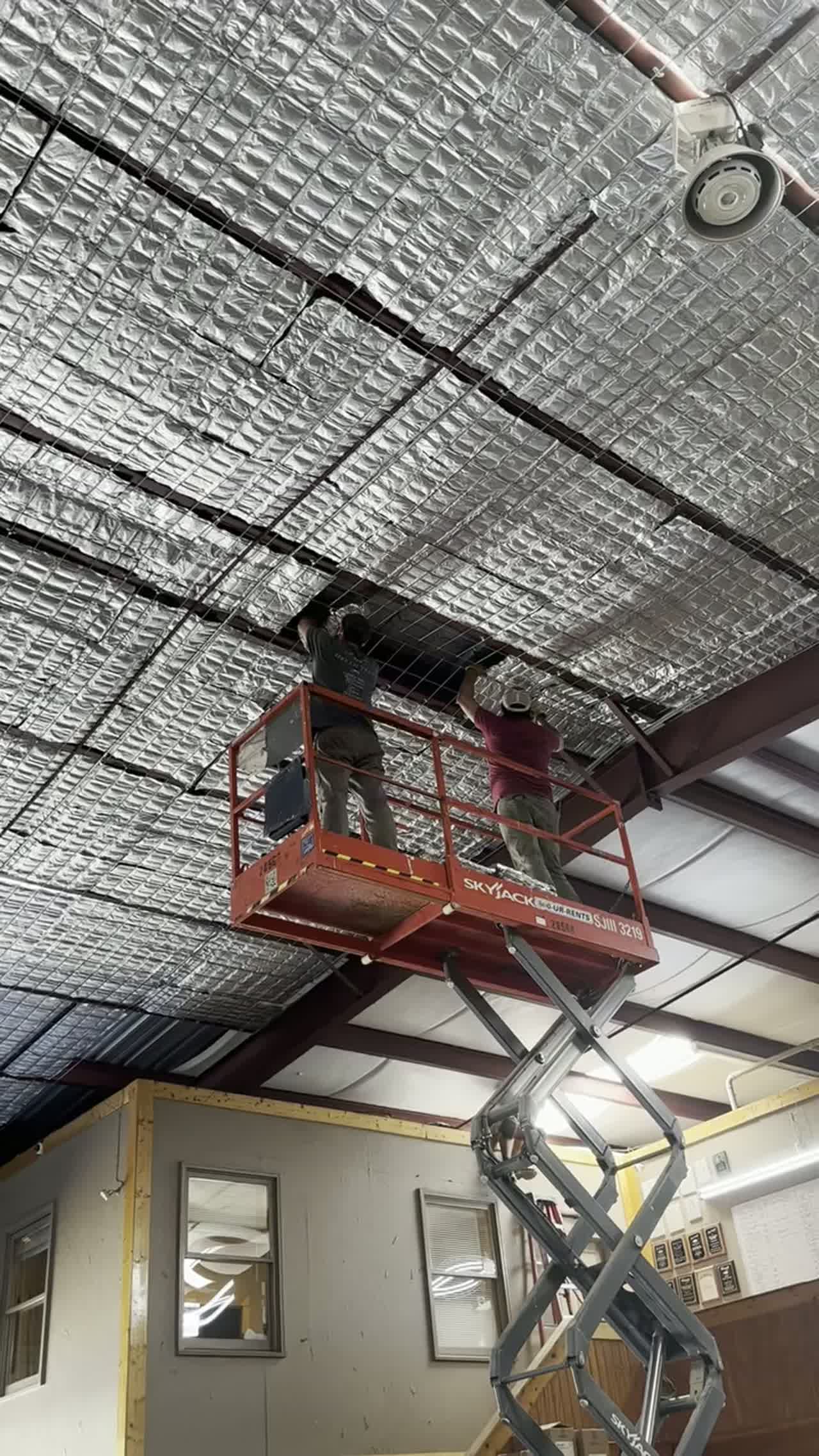 EnigMat PCM blankets installed across a building envelope as a heat barrier